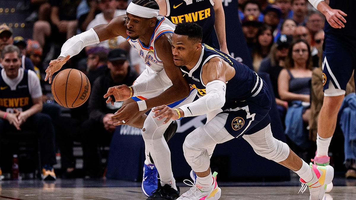 Thunder guard Shai Gilgeous-Alexander (2) and Denver Nuggets guard Russell Westbrook (4) dive for a loose ball in the fourth quarter during game four of the second round of the 2025 NBA Playoffs at Ball Arena