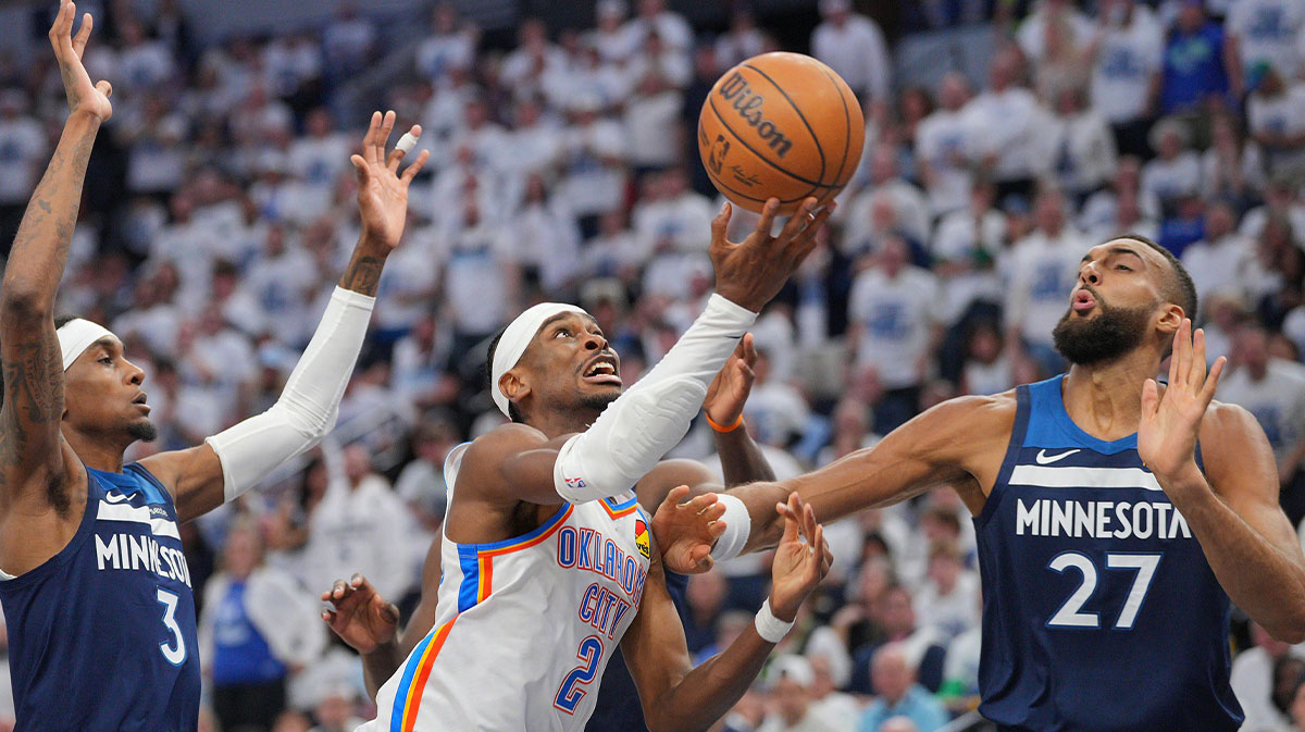 Thunder guard Shai Gilgeous-Alexander (2) shoots the ball over Minnesota Timberwolves center Rudy Gobert (27) during the first half in game three of the western conference finals for the 2025 NBA Playoffs at Target Center