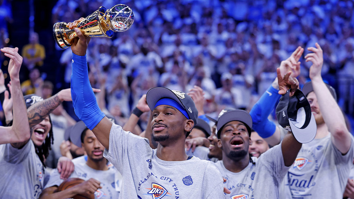 Thunder guard Shai Gilgeous-Alexander (2) celebrates with Magic Johnson West Conference Finals MVP trophy after defeating the Minnesota Timberwolves in game five to win the western conference finals for the 2025 NBA Playoffs at Paycom Center