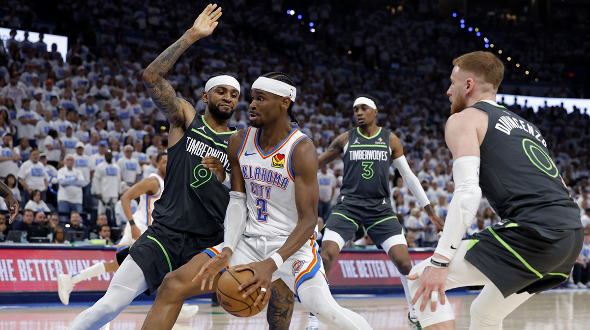 Oklahoma City Thunder guard Shai Gilgeous-Alexander (2) drives against Minnesota Timberwolves guard Nickeil Alexander-Walker (9) in the fourth quarter during game one of the western conference finals for the 2025 NBA Playoffs at Paycom Center.