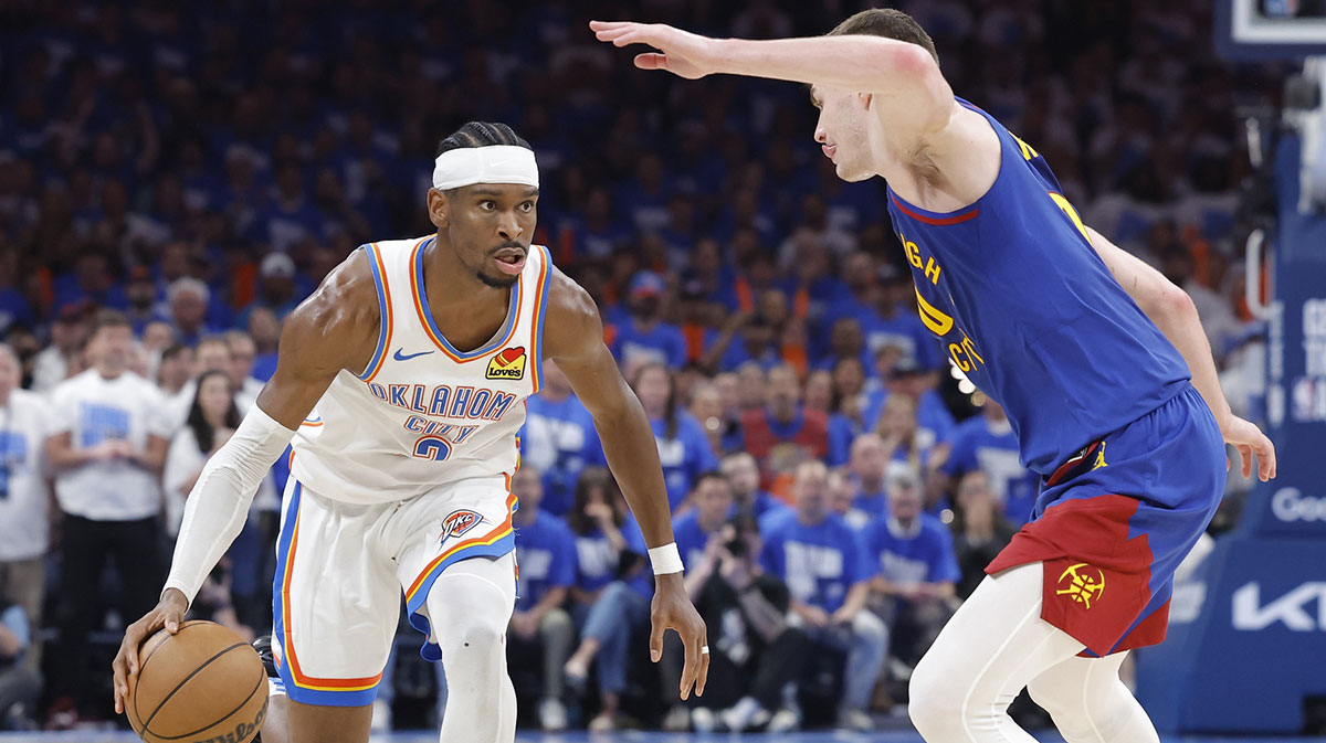 Oklahoma City Thunder guard Shai Gilgeous-Alexander (2) drives down the court beside Denver Nuggets guard Christian Braun (0) during the second half of game five of the second round for the 2025 NBA Playoffs at Paycom Center.