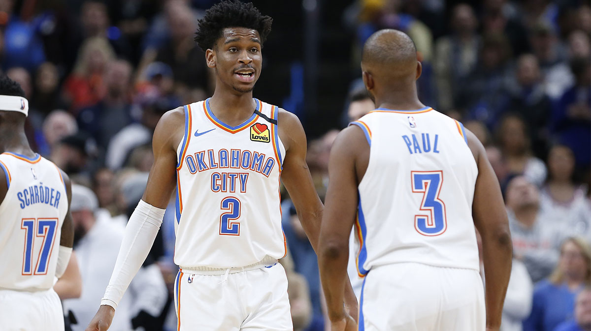 Oklahoma City Thunder guard Shai Gilgeous-Alexander (2) and guard Chris Paul (3) talk between plays against the Cleveland Cavaliers during the second half at Chesapeake Energy Arena. Oklahoma City won 109-103.