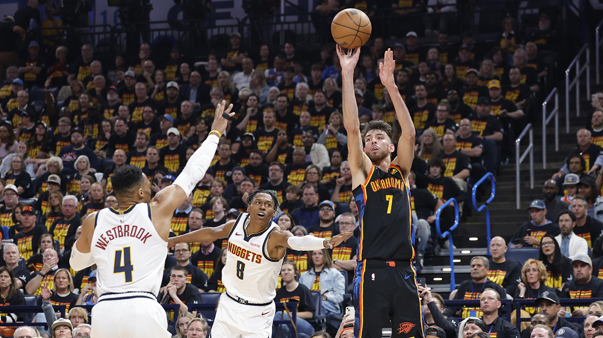 Thunder forward Chet Holmgren (7) shoots a three point basket against the Denver Nuggets during the second half in game one of the second round for the 2025 NBA Playoffs at Paycom Center