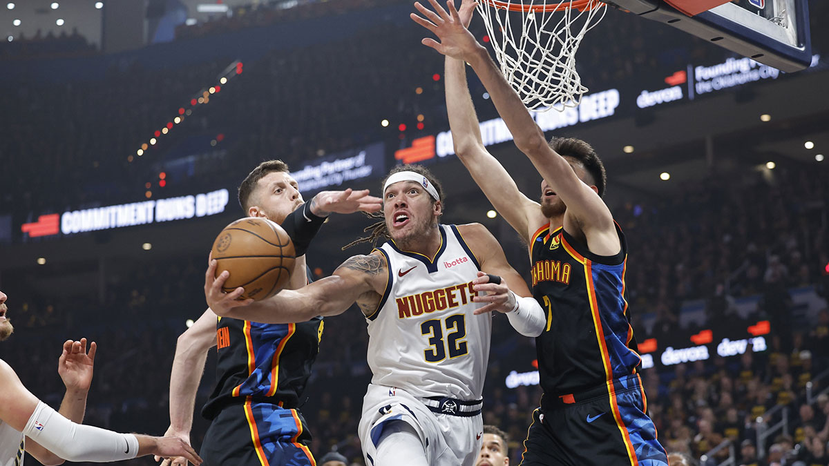 Nuggets forward Aaron Gordon (32) shoots from under the basket between Oklahoma City Thunder center Isaiah Hartenstein (55) and forward Chet Holmgren (7) in the first quarter during game two of the second round for the 2025 NBA Playoffs at Paycom Center