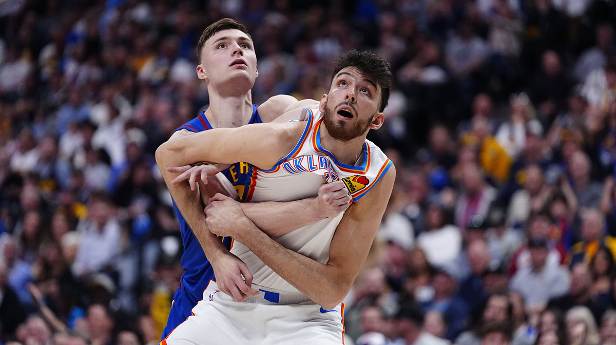 Thunder forward Chet Holmgren (7) and Denver Nuggets guard Christian Braun (0) battle for position on the court in the second half during game three of the second round for the 2025 NBA Playoffs at Ball Arena