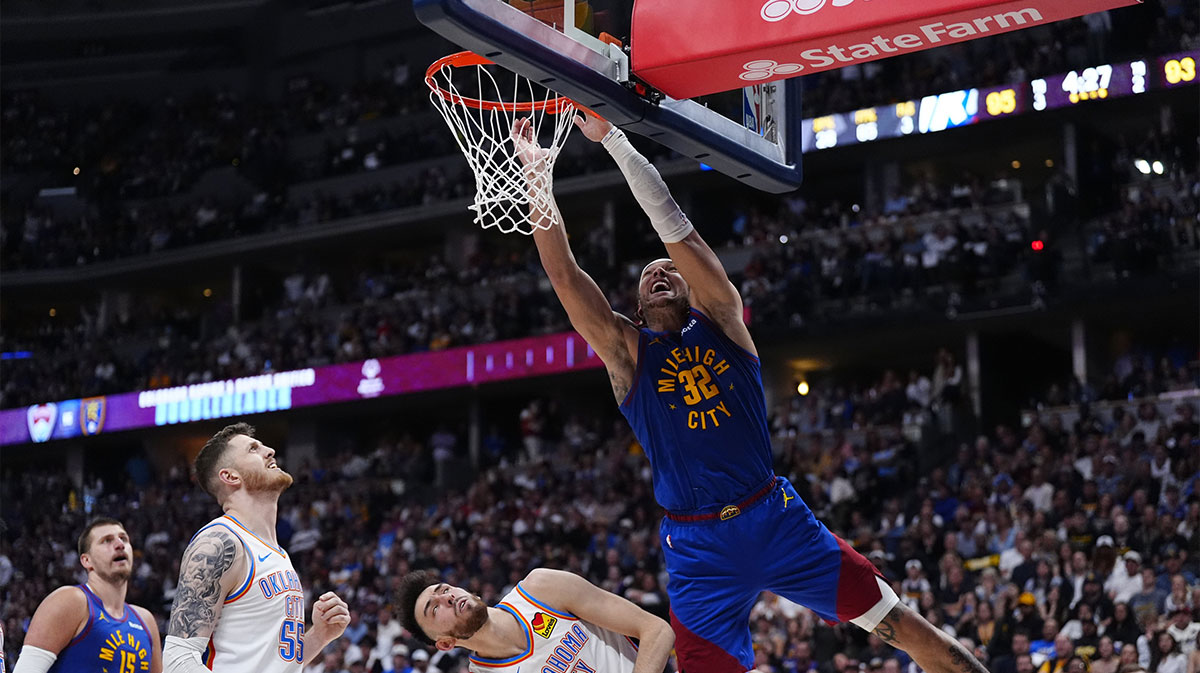 Thunder forward Chet Holmgren (7) and Denver Nuggets guard Christian Braun (0) battle for position on the court in the second half during game three of the second round for the 2025 NBA Playoffs at Ball Arena