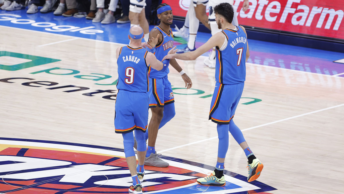 Thunder guard Shai Gilgeous-Alexander (2), guard Alex Caruso (9) and forward Chet Holmgren (7) celebrate after a play against the Memphis Grizzlies in the second quarter during game two of first round for the 2024 NBA Playoffs at Paycom Center