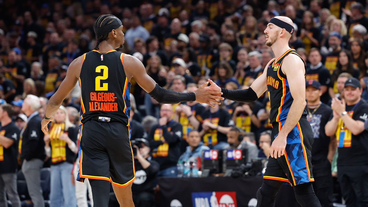 Thunder guard Shai Gilgeous-Alexander (2) and guard Alex Caruso (9) high five after a play against the Denver Nuggets during the second half during game one of the second round for the 2025 NBA Playoffs at Paycom Center