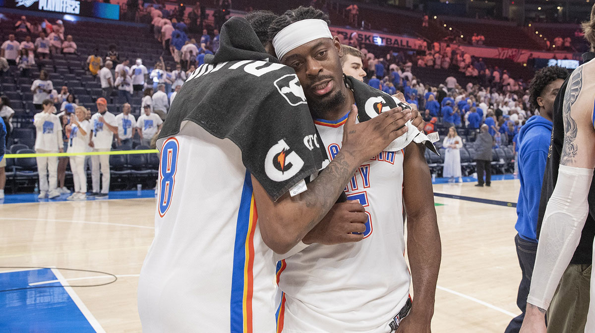 Thunder forward Jalen Williams (8) and guard Luguentz Dort (5) hug after their team defeated the Denver Nuggets during the second half of game five of the second round for the 2025 NBA Playoffs at Paycom Center