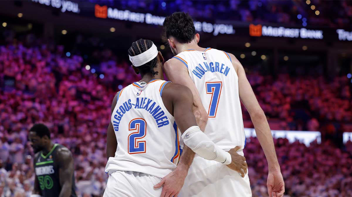 Thunder guard Shai Gilgeous-Alexander (2) and forward Chet Holmgren (7) react