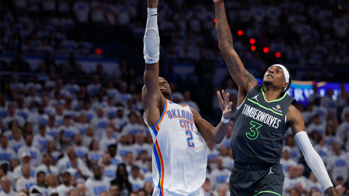 Oklahoma City Thunder guard Shai Gilgeous-Alexander (2) drives against Minnesota Timberwolves forward Jaden McDaniels (3) in the fourth quarter during game one of the western conference finals for the 2025 NBA Playoffs at Paycom Center.