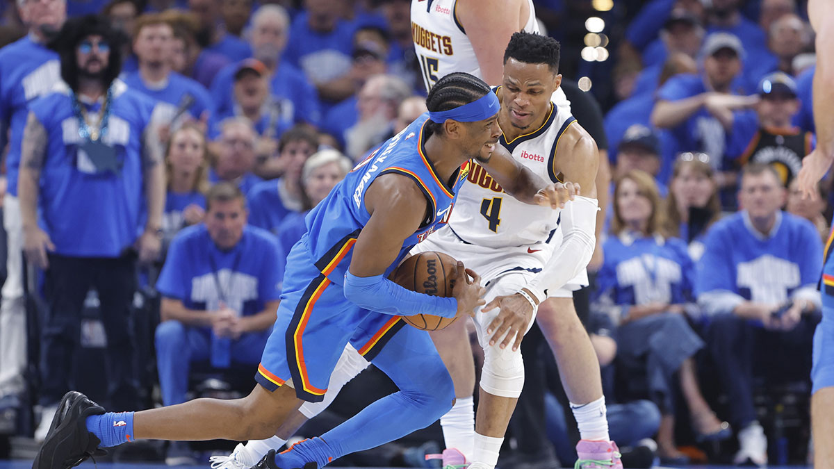 Oklahoma City Thunder guard Shai Gilgeous-Alexander (2) is fouled by Denver Nuggets guard Russell Westbrook (4) on a drive in the second quarter during game seven of the second round for the 2025 NBA Playoffs at Paycom Center.