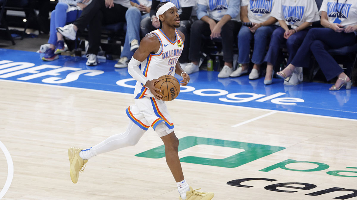 Oklahoma City Thunder guard Shai Gilgeous-Alexander (2) dribbles against the Minnesota Timberwolves in the first quarter during game one of the western conference finals for the 2025 NBA Playoffs at Paycom Center.