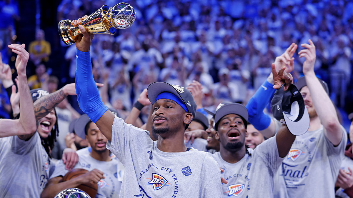 Oklahoma City Thunder guard Shai Gilgeous-Alexander (2) celebrates with Magic Johnson West Conference Finals MVP trophy after defeating the Minnesota Timberwolves in game five to win the western conference finals for the 2025 NBA Playoffs at Paycom Center.