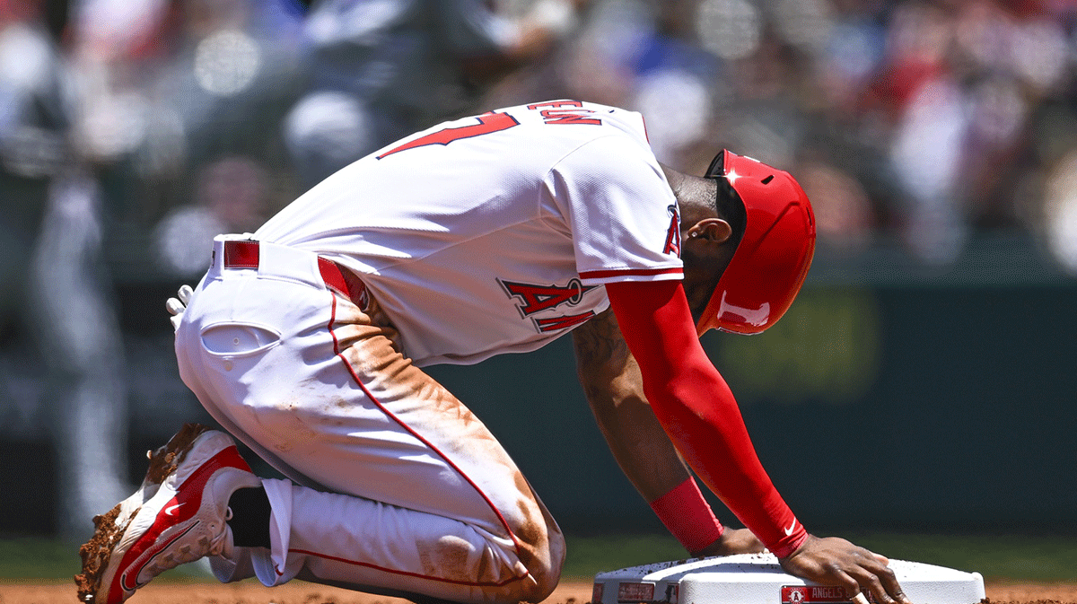 Los Angeles Angels shortstop Tim Anderson (77) forced out at second base against the Miami Marlins during the first inning at Angel Stadium.