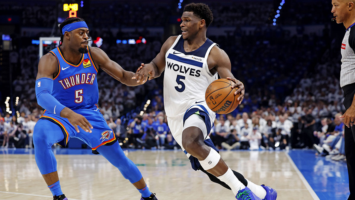 May 28, 2025; Oklahoma City, Oklahoma, USA; Minnesota Timberwolves guard Anthony Edwards (5) drives to the basket against Oklahoma City Thunder guard Luguentz Dort (5) during the second quarter in game five of the western conference finals for the 2025 NBA Playoffs at Paycom Center