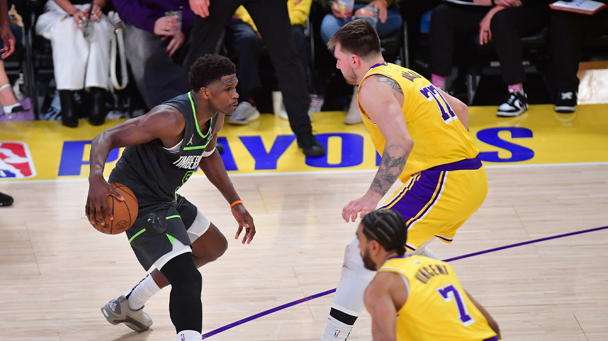 Minnesota Timberwolves forward Julius Randle (30) controls the ball against Los Angeles Lakers guard Luka Doncic (77) during the second half in game five of first round for the 2025 NBA Playoffs at Crypto.com Arena.