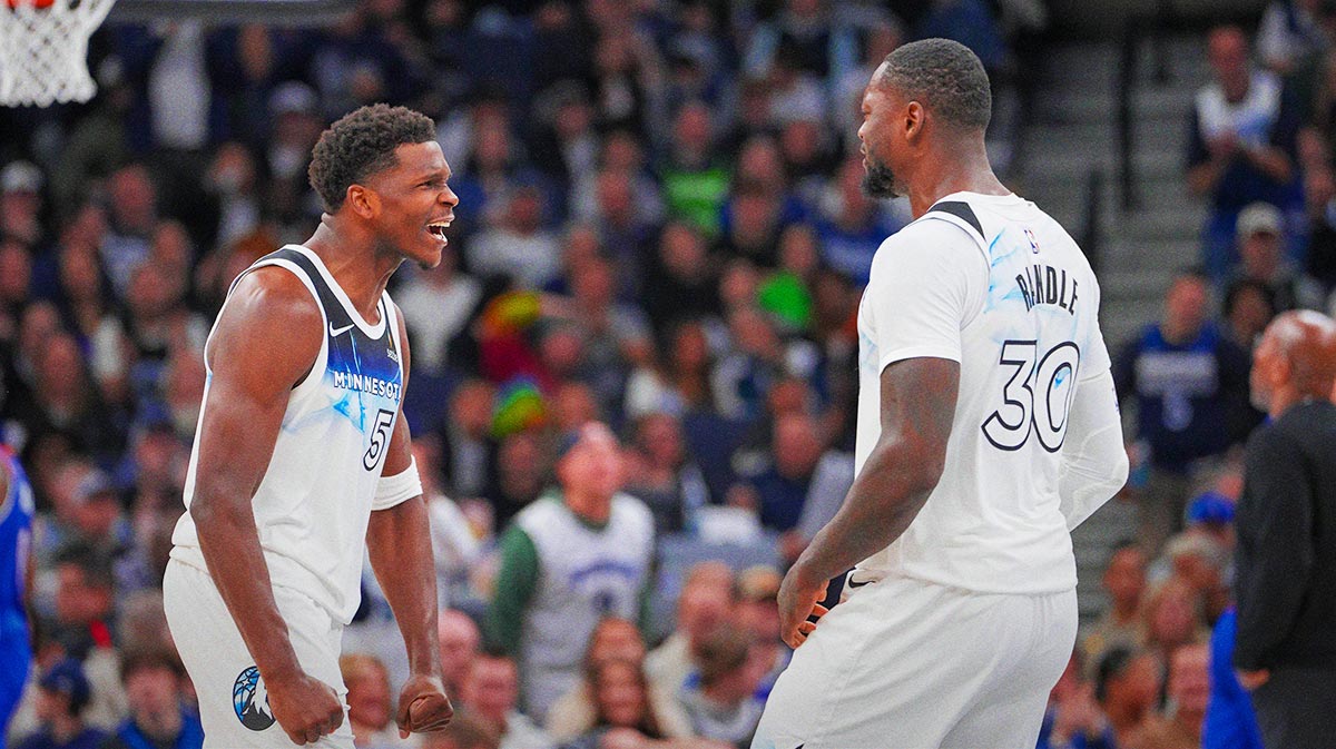 Minnesota Timberwolves guard Anthony Edwards (5) and forward Julius Randle (30) celebrate against the Sacramento Kings in the fourth quarter at Target Center.