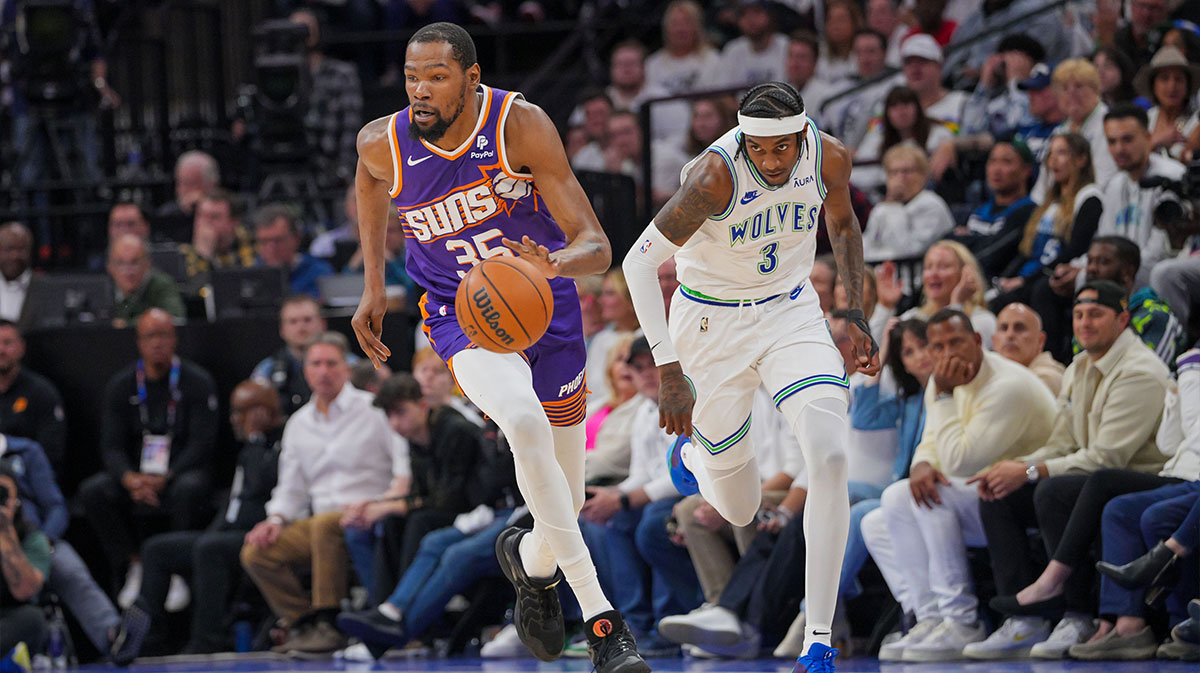 Phoenix Suns forward Kevin Durant (35) dribbles against Minnesota Timberwolves forward Jaden McDaniels (3) in the second quarter during game two of the first round for the 2024 NBA playoffs at Target Center.