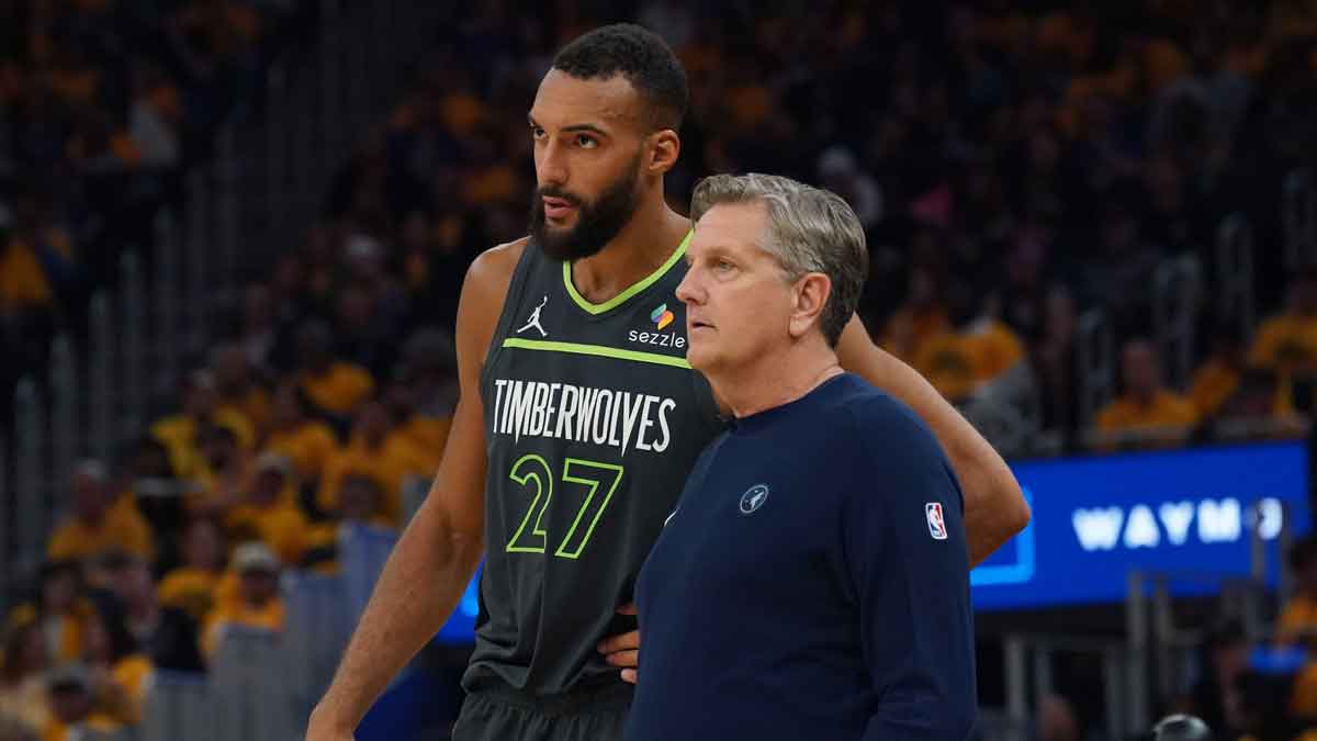 Timberwolves center Rudy Gobert talks to Chris Finch
