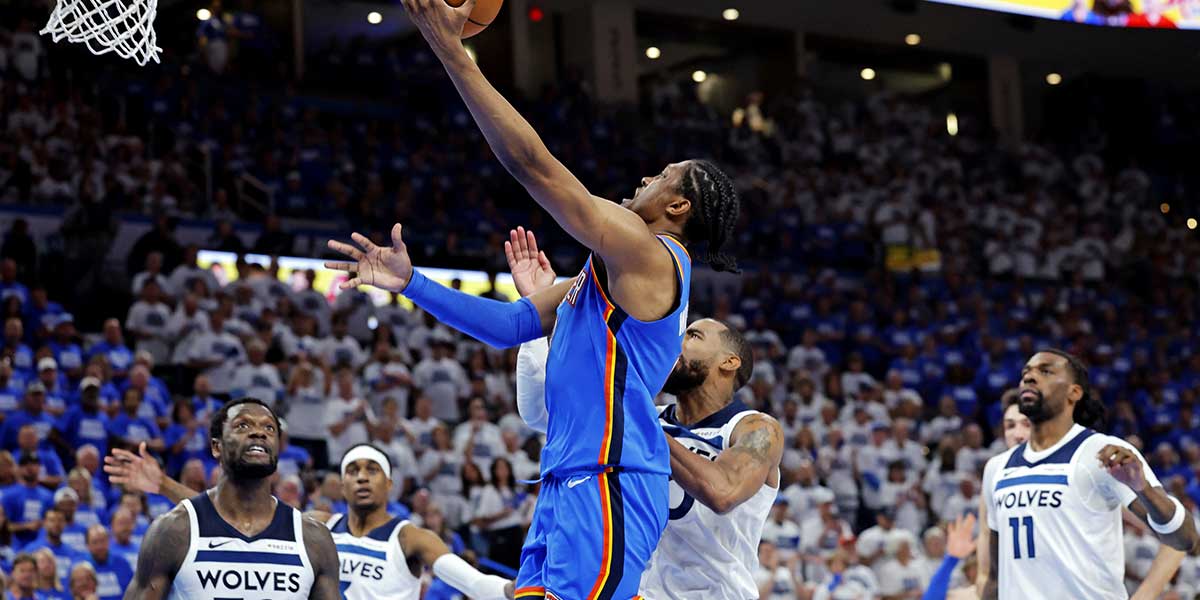Oklahoma City Thunder forward Jalen Williams (8) drives to the basket against Minnesota Timberwolves guard Mike Conley (10) during the fourth quarter in game five of the western conference finals for the 2025 NBA Playoffs at Paycom Center.