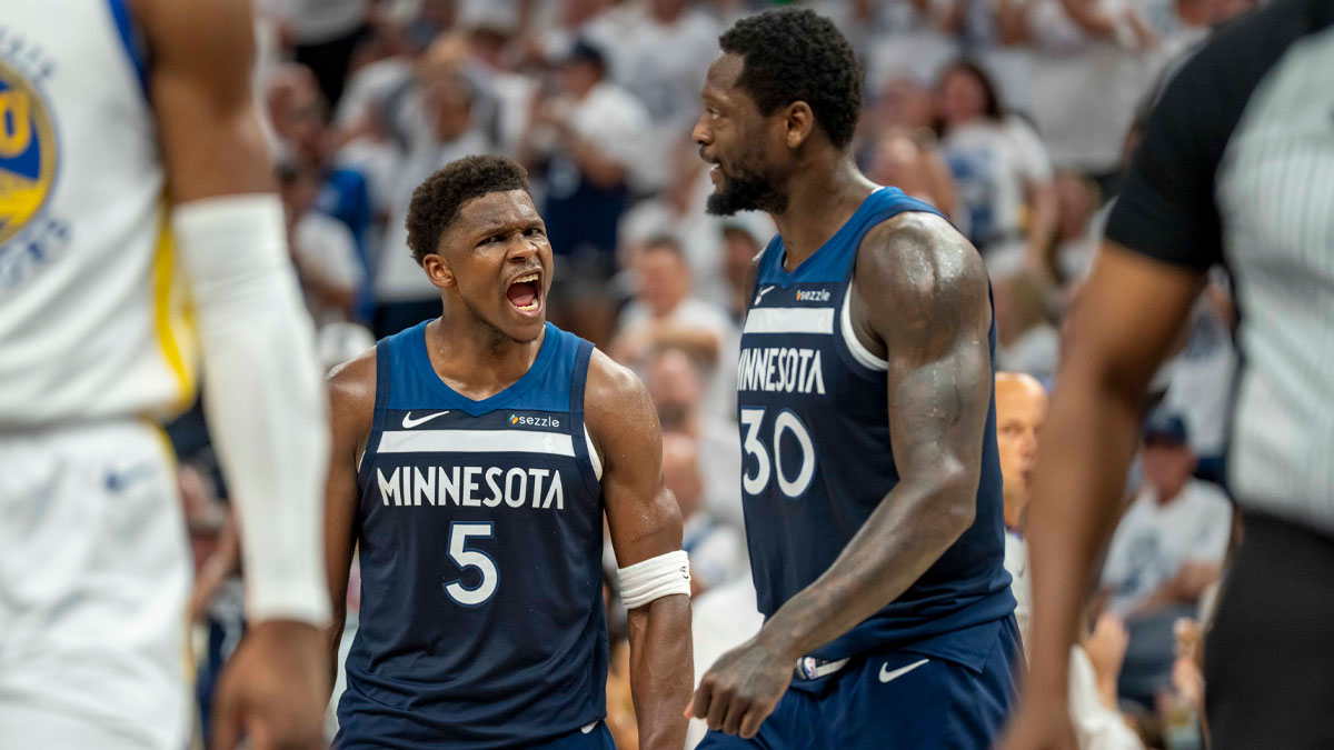 Minnesota Timberwolves guard Anthony Edwards (5) celebrates with Minnesota Timberwolves forward Julius Randle (30) after making a shot against the Golden State Warriors in the first half during game five of the second round for the 2025 NBA Playoffs at Target Center. Mandatory Credit: