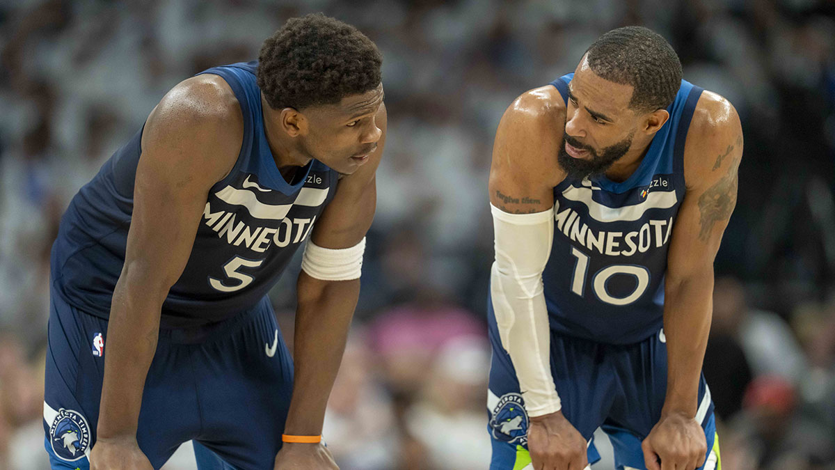 Minnesota Timberwolves guard Anthony Edwards (5) looks on with Minnesota Timberwolves guard Mike Conley (10) against the Golden State Warriors in the first half during game five of the second round for the 2025 NBA Playoffs at Target Center.