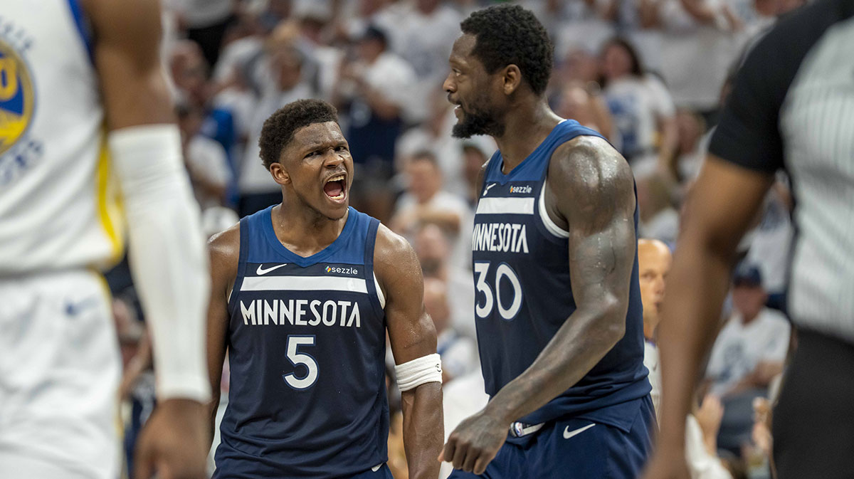 Timberwolves guard Anthony Edwards celebrates with Julius Randle