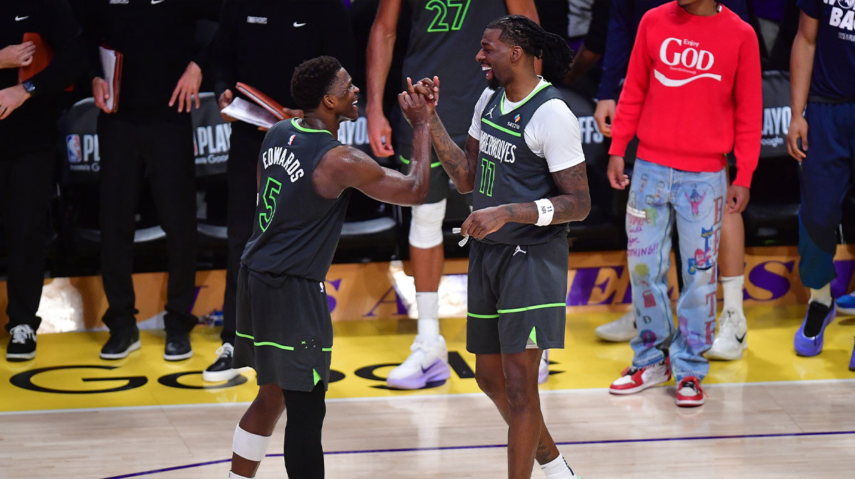 Minnesota Timberwolves guard Anthony Edwards (5) and center Naz Reid (11) celebrate the series victory against the Los Angeles Lakers in game five of first round for the 2025 NBA Playoffs at Crypto.com Arena.