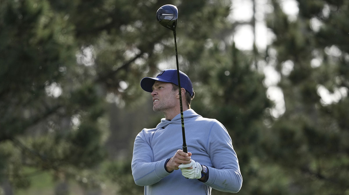 NFL former quarterback Tom Brady hits his tee shot on the 11th hole during the first round of the AT&T Pebble Beach Pro-Am golf tournament at Spyglass Hill Golf Course.