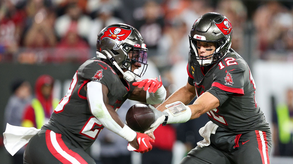 Tampa Bay Buccaneers quarterback Tom Brady (12) hands off to running back Rachaad White (29) in the fourth quarter at Raymond James Stadium.