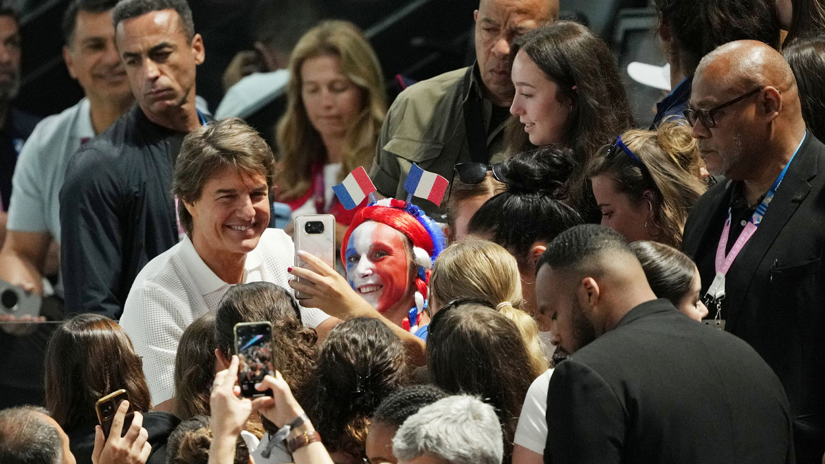 Mission: Impossible star Tom Cruise, who talked about his desire to retire, meeting fans at the Olympics.