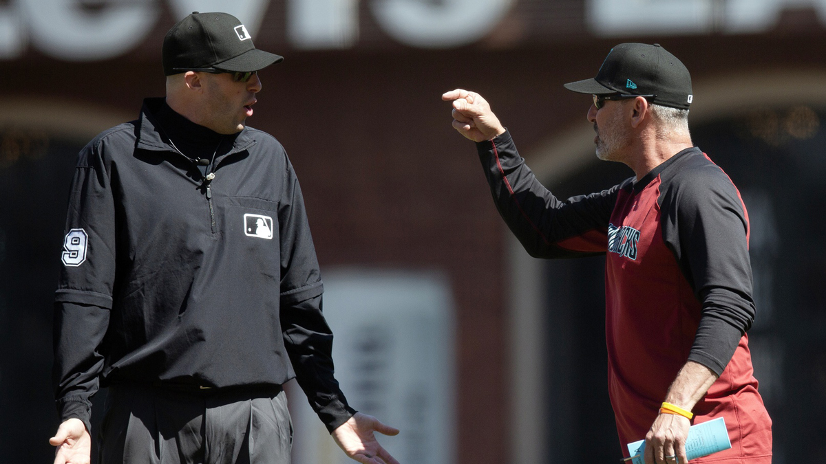 May 14, 2025; San Francisco, California, USA; Arizona Diamondbacks manager Torey Lovullo (right) ejects umpire Nic Lentz (59) after umpires ejected him during the eighth inning against the San Francisco Giants at Oracle Park. Mandatory Credit: D. Ross Cameron-Imagn Images