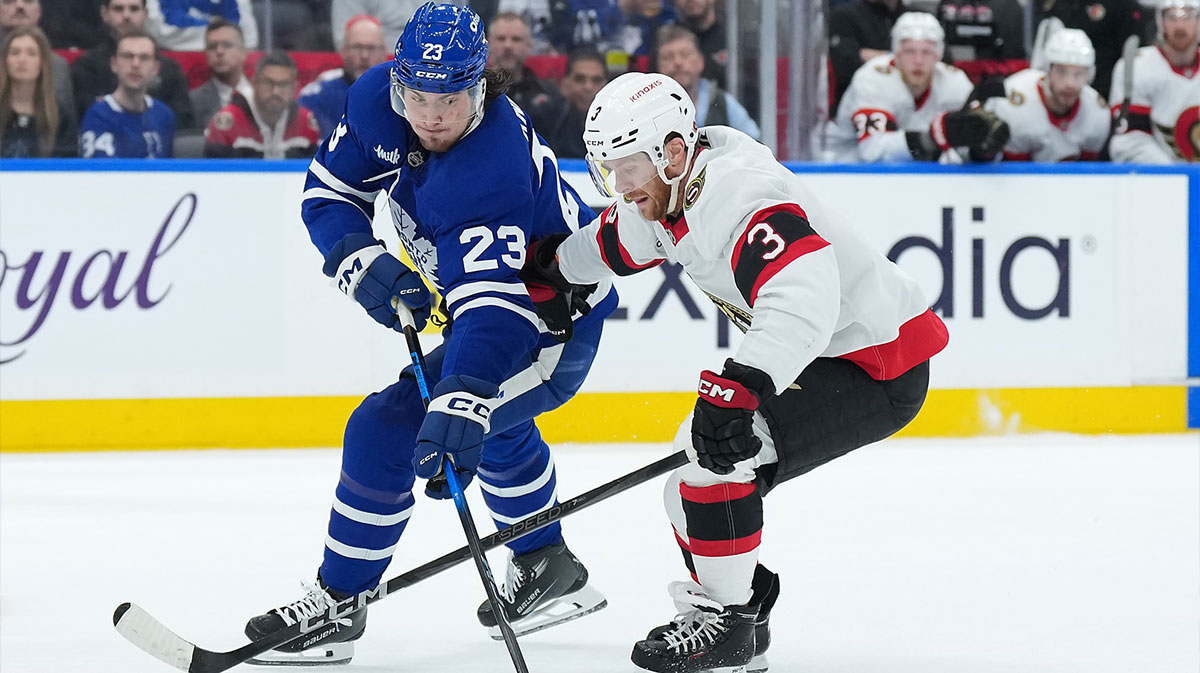 Toronto Maple Leafs left wing Matthew Knies (23) battles for the puck with Ottawa Senators defenseman Nick Jensen (3) in the first period during game five of the first round of the 2025 Stanley Cup Playoffs at Scotiabank Arena.