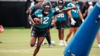May 10, 2025; Jacksonville, FL, USA; Jacksonville Jaguars wide receiver Travis Hunter (12) runs after completing a passing drill during rookie minicamp at Miller Electric Center.