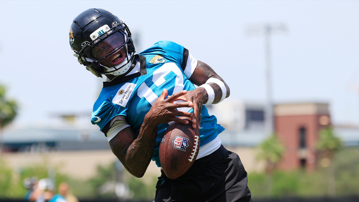 Jacksonville Jaguars wide receiver Travis Hunter (12) can't haul in a reception during the first organized team activity at Miller Electric Center Monday, May 19, 2025 in Jacksonville, Fla.