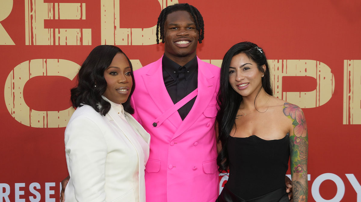 Apr 24, 2025; Green Bay, WI, USA; Colorado Buffaloes wide receiver Travis Hunter with his mother Ferrante Harris and his fiancee Leanna Lenee on the red carpet before the 2025 NFL Draft at Lambeau Field. Mandatory Credit: Kirby Lee-Imagn Images