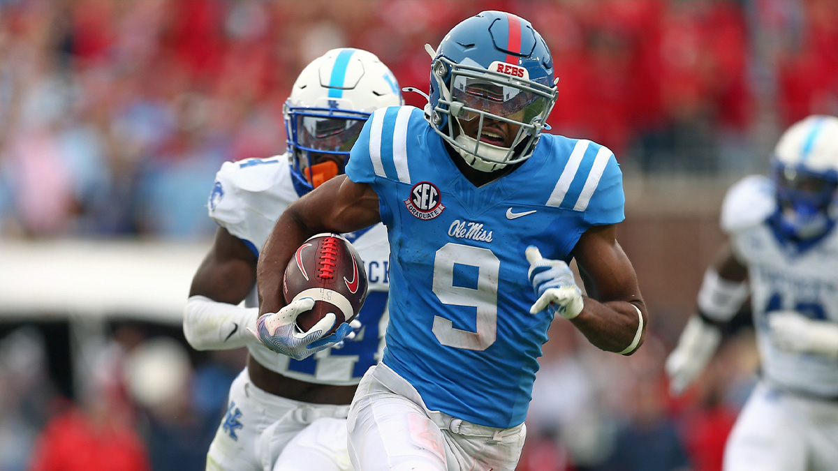 Mississippi Rebels wide receiver Tre Harris (9) runs after a catch for a first down as Kentucky Wildcats defensive back Jordan Lovett (25) pursues during the second half at Vaught-Hemingway Stadium.