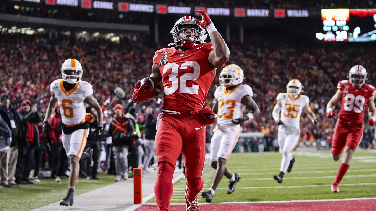 Ohio State Buckeyes running back TreVeyon Henderson (32) runs for a touchdown during the first half of the College Football Playoff first round game against the Tennessee Volunteers at Ohio Stadium in Columbus on Dec. 21, 2024.