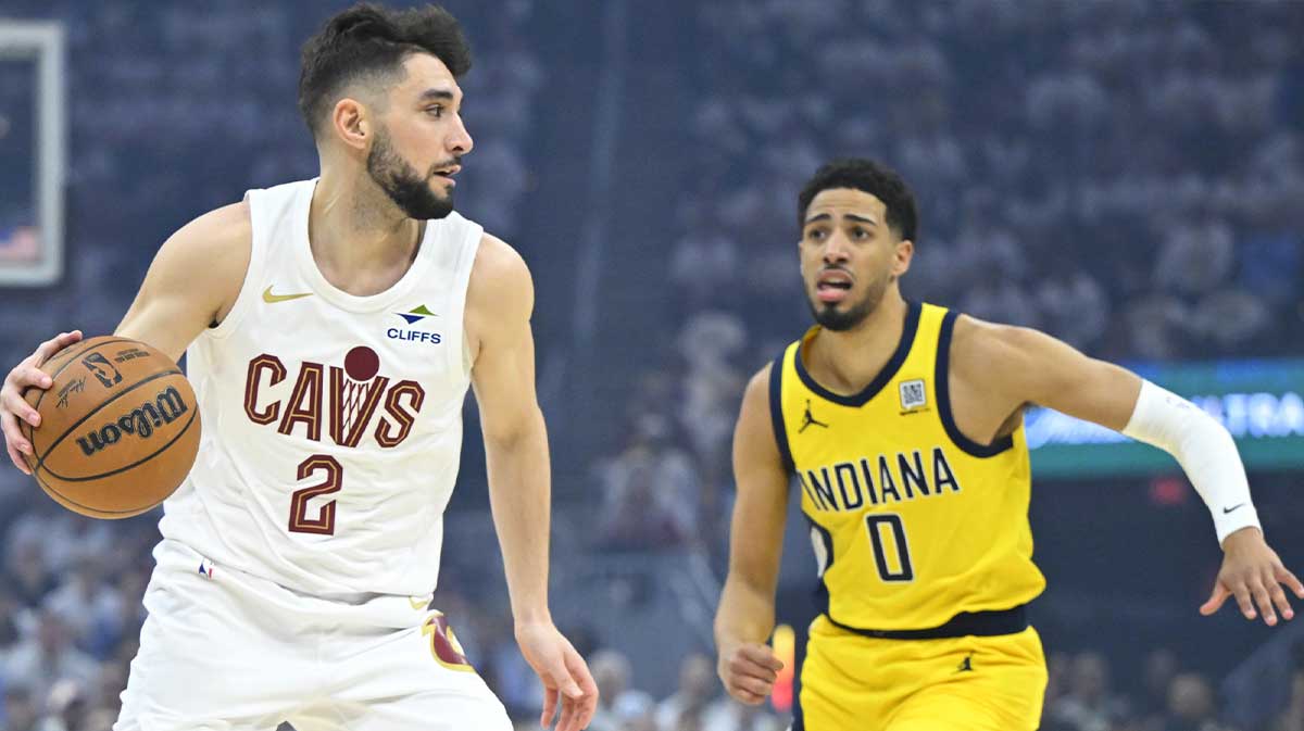 Cleveland Cavaliers guard Ty Jerome (2) dribbles beside Indiana Pacers guard Tyrese Haliburton (0) in the first quarter during game two of the second round of the 2025 NBA Playoffs at Rocket Arena.