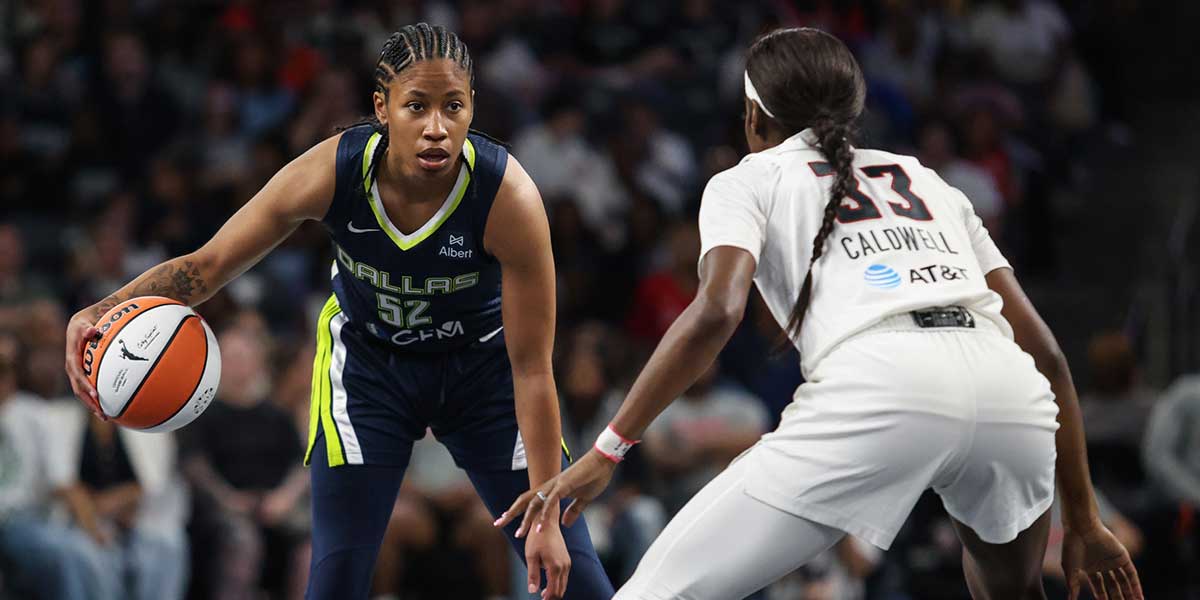 Atlanta Dream guard Maya Caldwell (33) plays defense against Dallas Wings guard Tyasha Harris (52) during the first quarter at Gateway Center Arena at College Park.