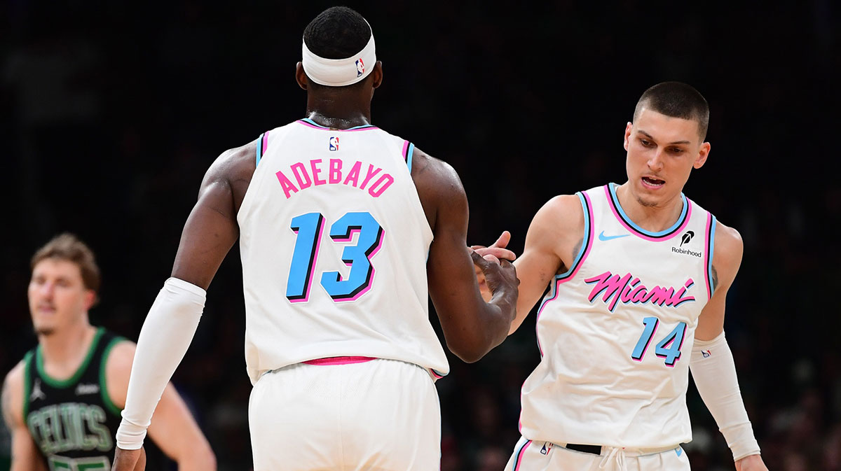 Miami Heat Center Bam Adebayo (13) is congratulated by goalkeeper Tyler Herro (14) after having made a basket during the second half against the Boston Celtics at TD Garden.