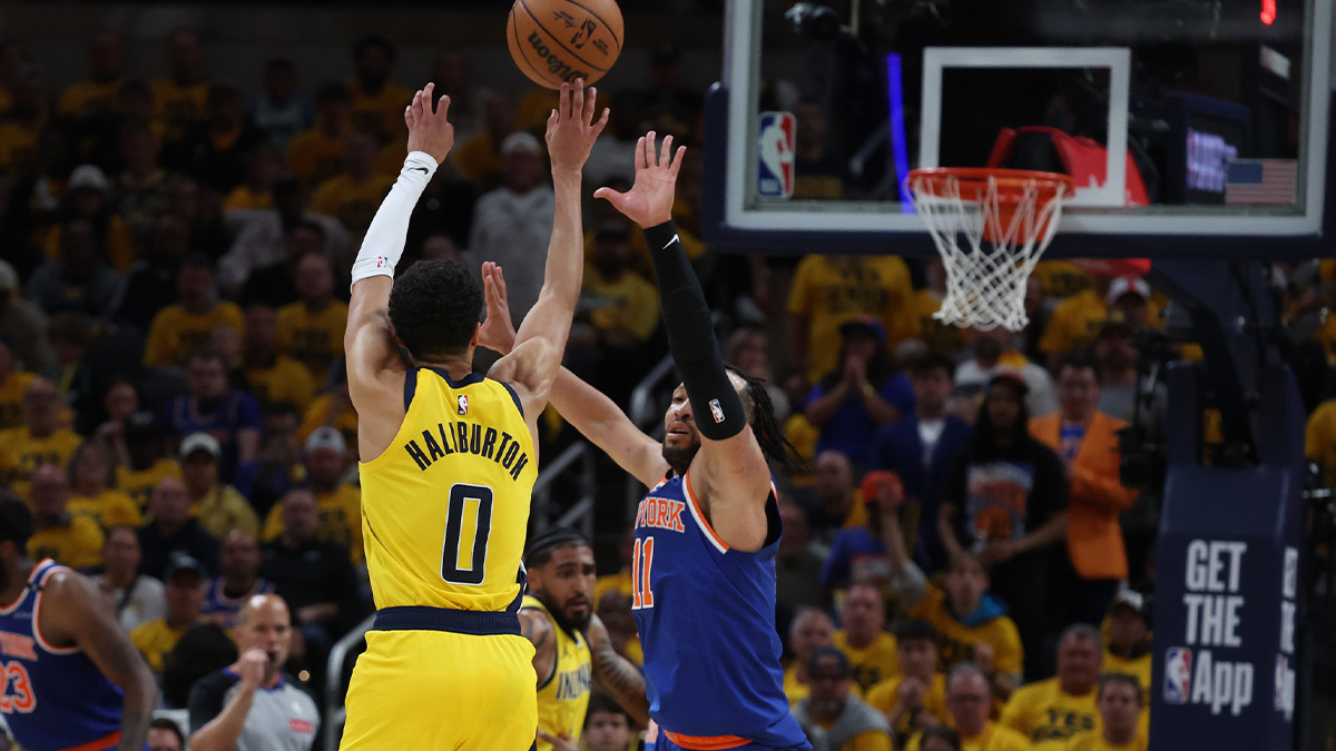 Indiana Pacers guard Tyrese Haliburton (0) shoots a three point basket over New York Knicks guard Jalen Brunson (11) during the third quarter of game four of the eastern conference finals for the 2025 NBA Playoffs at Gainbridge Fieldhouse.