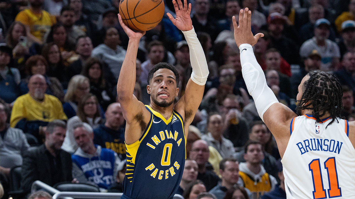 Indiana Pacers guard Tyrese Haliburton (0) shoots the ball while New York Knicks guard Jalen Brunson (11) defends in the first half at Gainbridge Fieldhouse.