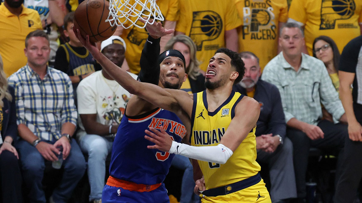 Indiana Pacers guard Tyrese Haliburton (0) shoots the ball against New York Knicks guard Josh Hart (3) in the fourth quarter during game six of the eastern conference finals for the 2025 NBA Playoffs at Gainbridge Fieldhouse.