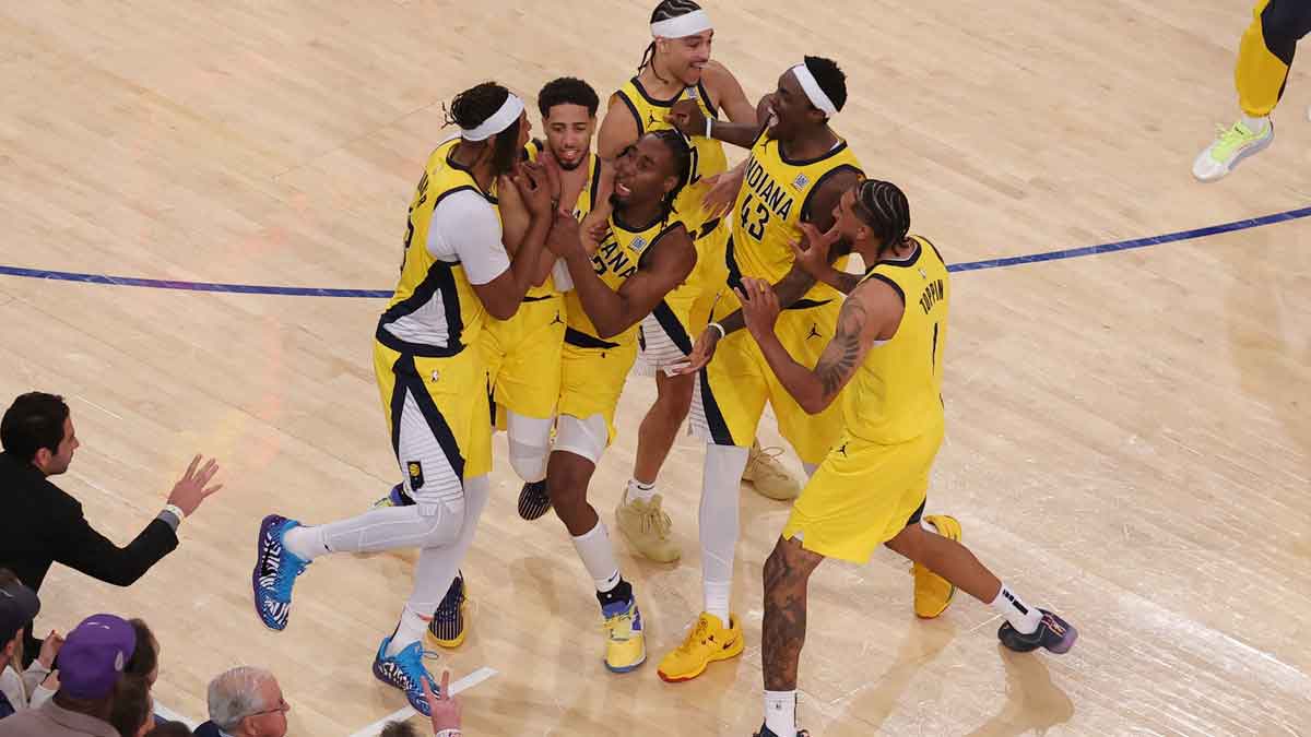 Indiana Pacers guard Tyrese Haliburton (0) celebrates with teammates after tying the game in the fourth quarter to send the game to overtime against the New York Knicks during game one of the eastern conference finals for the 2025 NBA Playoffs at Madison Square Garden.
