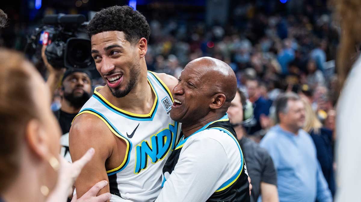 Indiana Pacers guard Tyrese Haliburton (0) and his dad celebrate the win over Milwaukee Bucks at Gainbridge Fieldhouse.