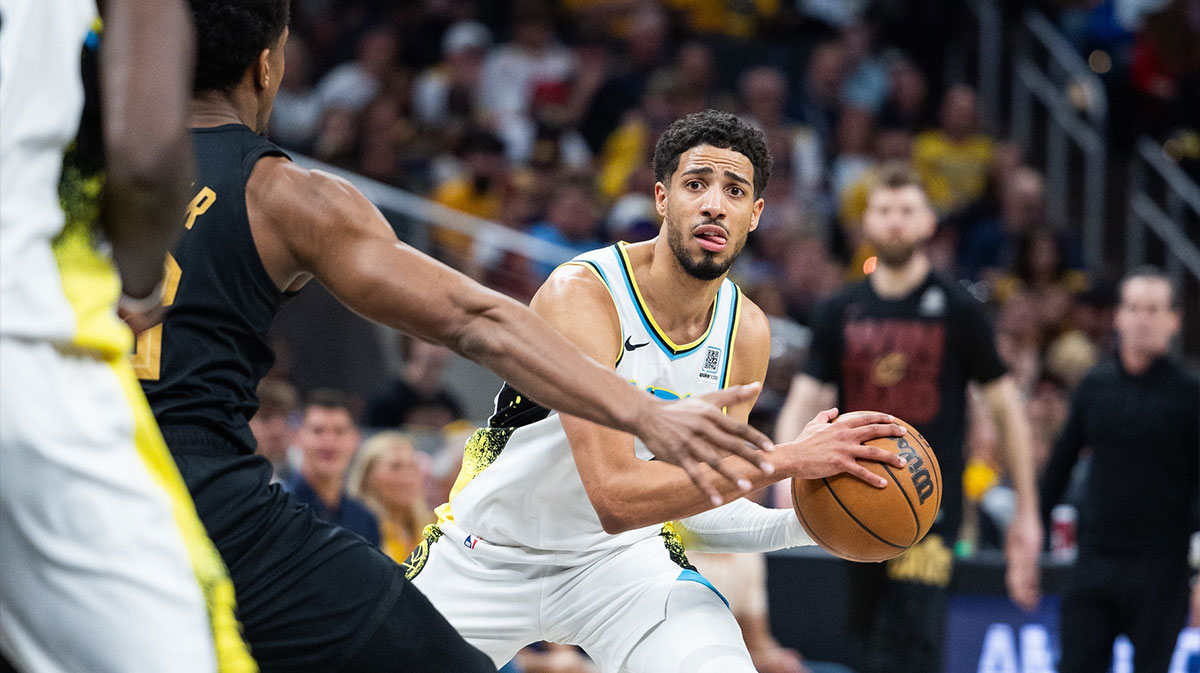 Indiana Pacers guard Tyrese Haliburton (0) holds the ball while Cleveland Cavaliers forward De'Andre Hunter (12) defends during game four of the second round for the 2025 NBA Playoffs at Gainbridge Fieldhouse.