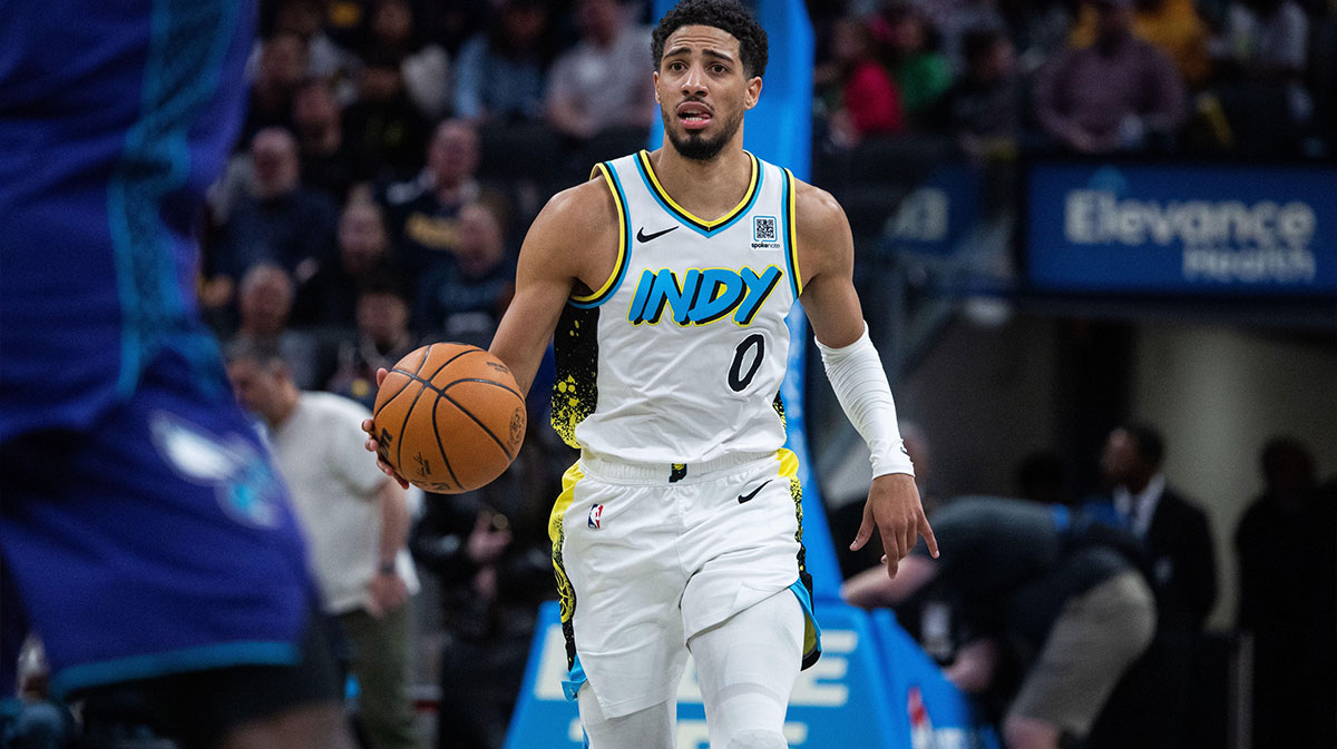 Indiana Pacers guard Tyrese Haliburton (0) dribbles in the second half against the Charlotte Hornets at Gainbridge Fieldhouse.