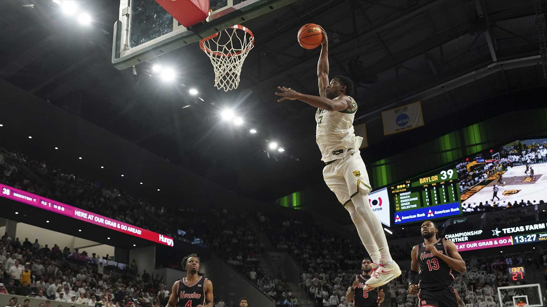 Baylor Bears guard VJ Edgecombe (7) dunks the ball ahead of Houston Cougars forward J'Wan Roberts (13) during the second half at Paul and Alejandra Foster Pavilion.
